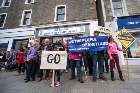 Protesters outside Alistair Carmichael's constituency office last Saturday. The protest is to be repeated this Saturday at 2pm.