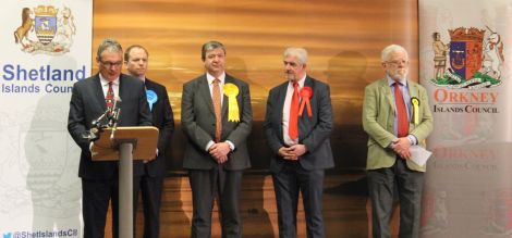 Returning officer Alistair Buchan confirming Alistair Carmichael had held onto his seat early on Friday. Photo: Shetnews