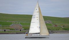 Serenity in full sail reaching the line at Lerwick on Thursday evening - Photo: John Anderson