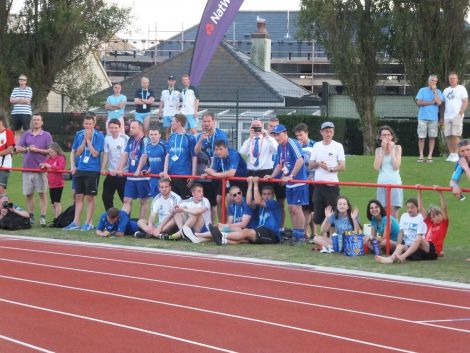 Shetland's footballers, fresh from securing a semi final place with a commanding 5-0 win over the Falklands, getting ready to cheer on Emma Leask in Tuesday night's athletics. Photo: Maurice Staples