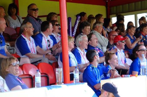 Team Shetland's travelling support in full voice during the footballers' match against the Falklands. Photo: Shetland Island Games Association