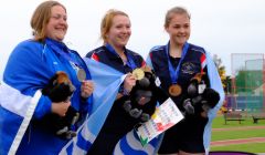 A proud moment for Elaine Park (left) as she receives her silver medal for the hammer throw. Photo courtesy of Shetland Island Games Association