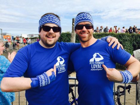 The two Andrews, Hutton and Simpson, showing their supporter for Team Shetland - and their particular favourite, triathlete Pete Fenwick.