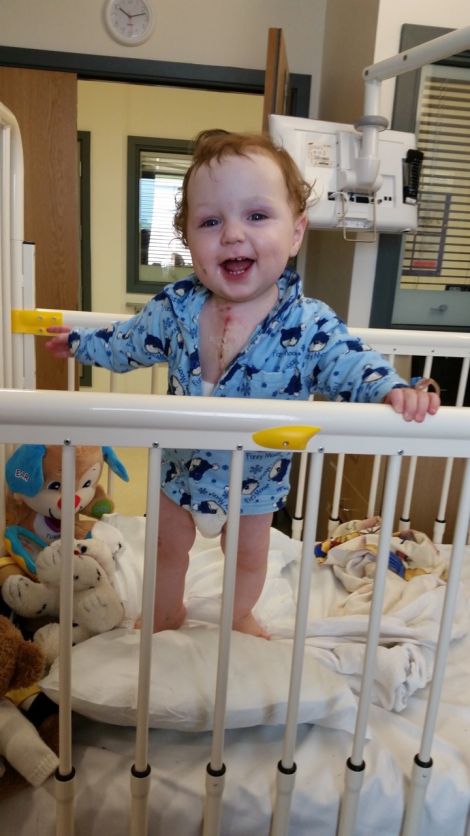 A happy Joshua in hospital after the operation.