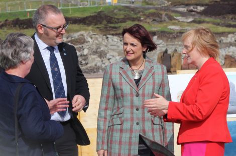 Council leader Gary Robinson (here with education committee chairwoman Vaila Wishart (left), education secretary Angela Constance (centre) and SIC director of children's services) said he was "very pleased" that the council had managed to overcome all the obstacles and was finally building the new high school for Shetland.