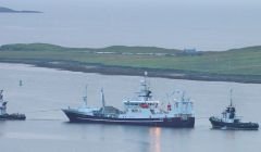 Resolute getting assistance from the harbour tugs this morning. Photo: Ian Leask