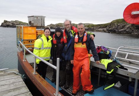 SSPCA auxiliary officer Terresa Leask, Jan and Pete Bevington from Hillswick Wildlife Sanctuary and Sean Williamson on board his creel boat Emeritus back at Bousta after rescuing the seal.