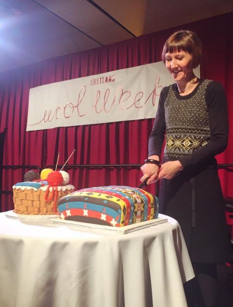 This year's Shetland Wool Week patron Donna Smith cutting the cake - Photo: Shetland Wool week