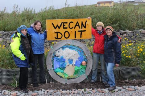 Da Wives Atween Wadders with their bruck collage of a polar bear on a shrinking iceberg. From left: Jan Bevington, Sue Hinton, Aurore Whitworth and Bunchy Casey. Photo HWS