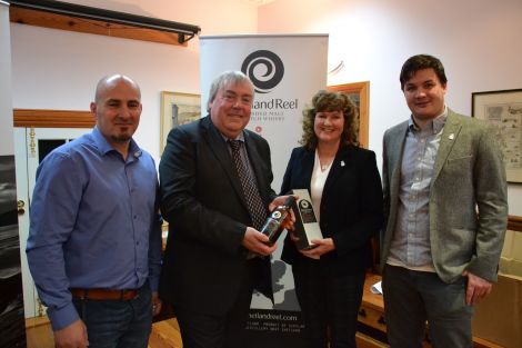 Pictured at the launch of a new Shetland whisky (from left): distillery manager Mark Turnbull, VisitScotland chief executive Malcolm Roughead, distillery co-owner Debbie Strang and product developer Marc Watson. Photo: Shetnews/Neil Riddell