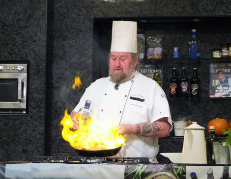 Chef Glynn Wright, who is about to open a steakhouse in Lerwick, fanning the flames. Photo: Elizabeth Atia