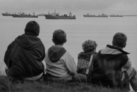 Kids in Lerwick watch the klondykers from the safety of the banks. Photo Jeremy Sutton-Hibbert