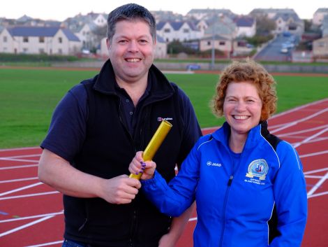 SIGA chairman Andrew Inkster hands over the baton to new chairwoman Karen Woods. Photo: SIGA