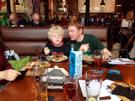 Shetland BrewDog campaigner Ben Gray with his 10 year old son Joshua enjoying a bite at BrewDog Aberdeen. Photo Emilie Gray