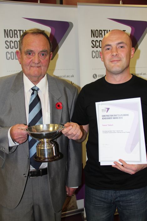 Trevor Tulloch (right) received his awards from past president of the Scottish Decorators Federation Eric Rasmussen.