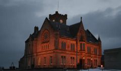 Midnight oil is being burned at Lerwick Town Hall aa councillors ands officials work out how to make extra savings after this week's shock of a 4.5 per cent cut to their government grant.