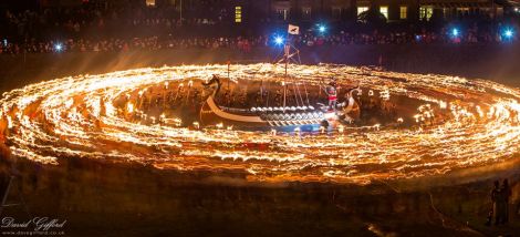 Dave Gifford's classic photo of the culmination of Tuesday's procession in Lerwick as a thousand guizers prepare to cast their burning torches into the galley.