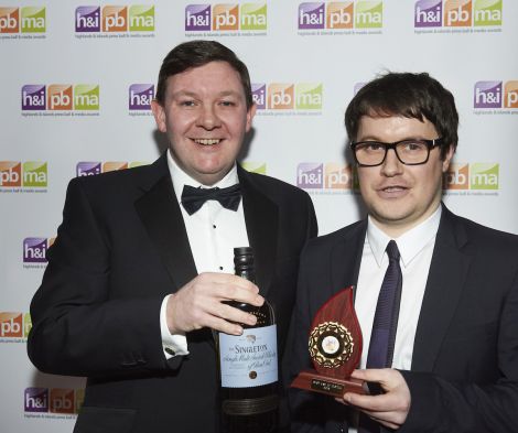 Shetland News reporter Neil Riddell (right) collecting one of two awards from Keith Miller of the main sponsor of the media awards event, drinks company Diageo - Photo: Lucid PR