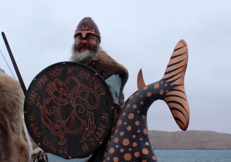 Guider Jarl Thorir Hund at the tail end of his galley Ain Urrida on a wet and windy Friday afternoon in Hillswick.