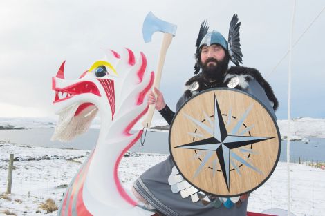 Nesting and Girlsta Jarl Mark Gifford on his galley Sneckan reviving the red and white colours from his grandfather Charlie Anderson's day. Photo Malcolm Younger/Millgaet Media