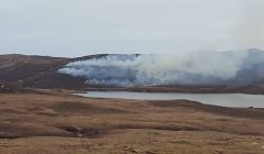 A grass fire in Sandness threatened nearby overhead power lines. Photo Michael Mann