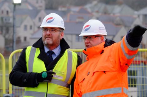 Council leader Gary Robinson and Anderson High School project director Mark Clarke discussing the details of the building work - Photo: SIC