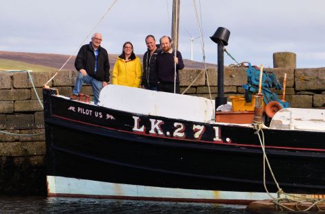 The Shetland Boat Week organising team on board the Pilot Us (left to right): Brian Wishart, Emma Miller, John Henderson of main sponsor Ocean Kinetics, and Dr Ian Tait of Shetland Museum and Archives.