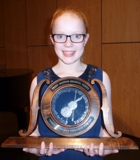 An extremely happy Jodie Smith after being judged Shetland's Young Fiddler of the Year, aged just 13. All photos Valerie Watt