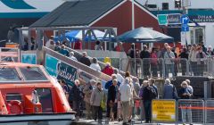 Cruise passengers step ashore on the new pontoons at Lerwick's Victoria Pier. Photo LPA