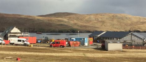 The five sheltered houses on the right are almost complete while weeks of work lie ahead for the warden's house on the left.