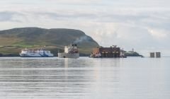 The heavy lifting vessel Xiang Yun Kou submerged herself to unload a huge Premier Oil tank in Brei Wick, in August 2014 - Photo: Austin Taylor