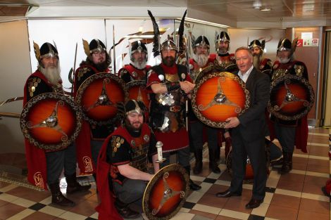 The 2016 Lerwick jarl squad pose with Serco NorthLink managing director Stuart Garrett before setting sail for the Big Apple.