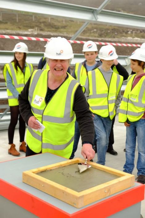 Cementing progress on the new halls of residence on Tuesday is SIC education committee chairwoman Vaila Wishart. Photo courtesy of SIC.