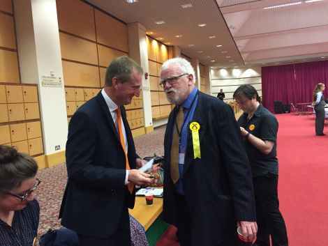 The SNP's Danus Skene conceding defeat to Tavish Scott at the Clickimin Bowls Hall on Thursday night.