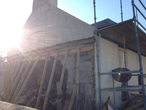 The collapsed gable end wall at an under-renovation Market Street property on Monday evening.