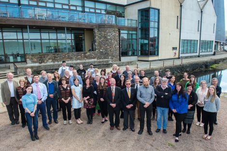 Members of the museum and the archives services along with admin staff from Shetland Amenity Trust and trustees came together for an official anniversary photo on Tuesday - Photo: Malcolm Younger