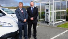 NHS Shetland chief executive Ralph Roberts and SIC leader Gary Robinson pictured at the Gilbertson Park's electric vehicle charging point last month. There are now a dozen points throughout the isles. Photo courtesy of SIC.