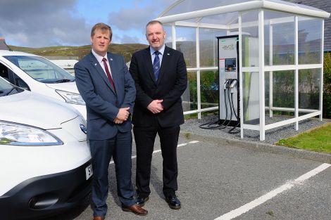 NHS Shetland chief executive Ralph Roberts and SIC leader Gary Robinson pictured at the Gilbertson Park's electric vehicle charging point last month. There are now a dozen points throughout the isles. Photo courtesy of SIC.