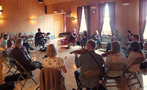 A fiddle workshop held in the Vidlin hall - Photo: Shetland Arts