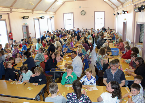 Locals and visitors alike enjoying the bingo at the Baltasound Hall.