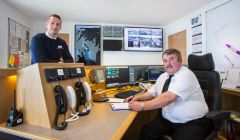 Deputy harbourmaster Alexander Simpson (left) and port controller Douglas Garrick appreciating the newly installed vessel monitoring system in the new port control room - Photo: John Coutts.