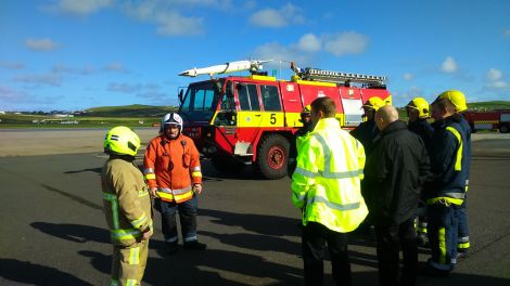 Andrew Dane meeting the fire crew at Sumburgh Airport on his visit to Shetland.