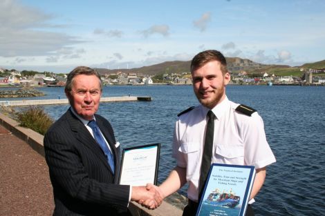 Ross Sinclair receiving his award from Captain George Sutherland.