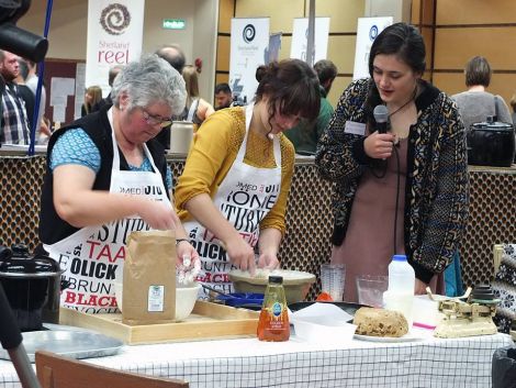 Marjolein Robertson follows a demonstration by Margaret Williamson, from Lunna Farm, and her granddaughter Kirsten Williamson, of how to make sheep's puddings - all photos: Elizabeth Atia.