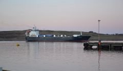 The NorthLink cargo boat Hildasay leaving Lerwick harbour.