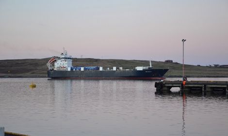 The NorthLink cargo boat Hildasay leaving Lerwick harbour.