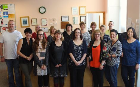 Some of the people working at Market House gather for a group photo in the reception area. Back row (l to r): Janice Hawick, Citizens Advice Bureau (CAB); Val Farnworth, Moving On Employment project (MOEP); Katrina McLachlan, Voluntary Action Shetland (VAS); Julie Manson, MOEP; Shona Manson, Family Mediation; Helen Fullerton, MOEP; Malcolm Johnson, Disability Shetland. Front row (l to r): Iain Souter, Victim Support; Louise Manson, MOEP; Alexis Robertson, CAB; Karen Eunson, CAB; Ellen Hughson, VAS, Mairi Jamieson, Shetland Befriending Scheme; Lynette Nicol, VAS; Ayesha Huda, VAS.