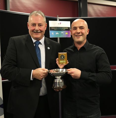 Trevor Tulloch (right) was presented with his two awards by Colin McKinnon, operations director for Robertson Construction Northern