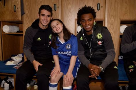 12 year old Macy pictured with Chelsea first team stars Oscar and Willian.