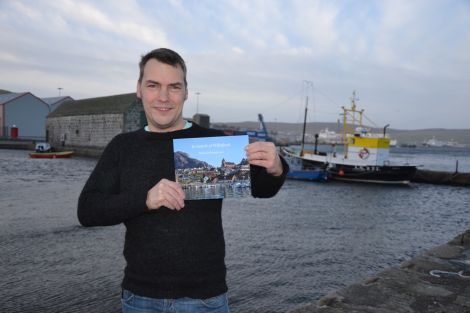 Fiddler Maurice Henderson proudly clutching a copy of his book In Search of Willafjord. Photo: Shetland News/Neil Riddell.